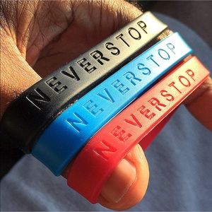 NEVER STOP Silicone Wristbands by PWR WEAR